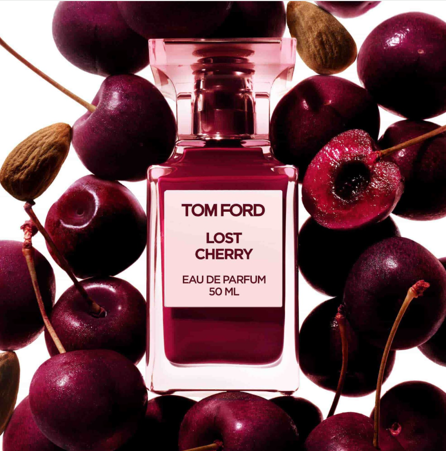 Tom Ford Lost Cherry Eau de Parfum bottle surrounded by fresh cherries and almonds