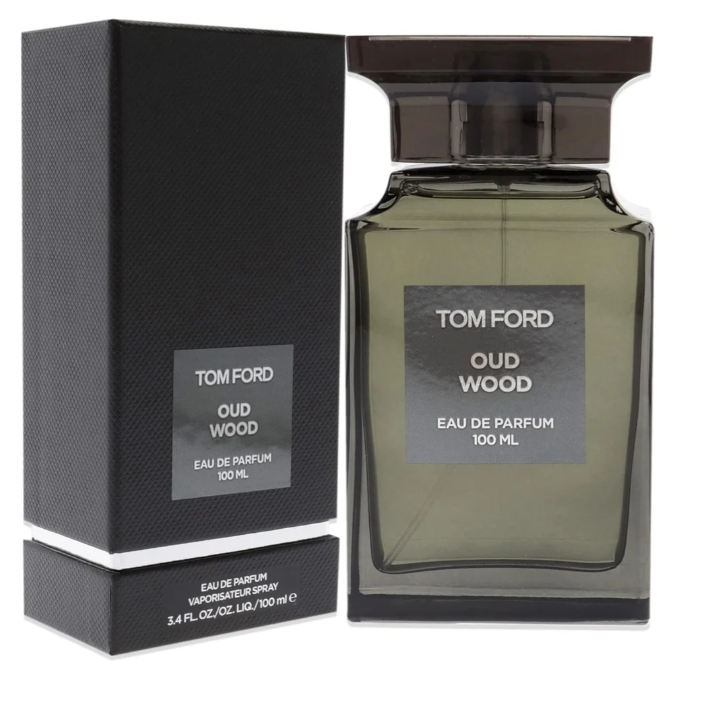 Tom Ford Oud Wood Eau de Parfum 100ml bottle beside its dark presentation box