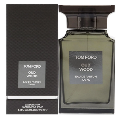 Tom Ford Oud Wood Eau de Parfum 100ml bottle beside its dark box